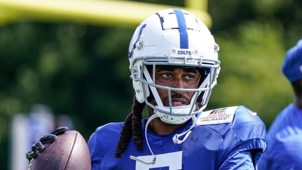 The Indianapolis Colts Stephon Gilmore(5) tosses a football around with teammates in between drills during Colts Camp on Monday, August 8, 2022, at Grand Park in Westfield Ind.
